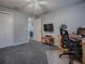 Bedroom featuring neutral paint with carpet and an open door to another room at 1377 Eagle Ridge Dr, The Villages, FL 32162