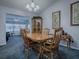 Cozy dining area with wood furniture, carpet and views to the living room at 1377 Eagle Ridge Dr, The Villages, FL 32162
