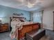 Cozy main bedroom with ceiling fan and large window for natural light at 1377 Eagle Ridge Dr, The Villages, FL 32162