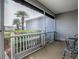 Relaxing screened porch with outdoor seating and a view of lush landscaping at 1377 Eagle Ridge Dr, The Villages, FL 32162