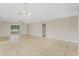 Living room featuring tile floors, neutral walls, ceiling fan, and a sliding door to outside at 140 Lake Catherine Cir, Groveland, FL 34736