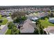 Beautiful single-story home with screened lanai, lush landscaping, and a well-manicured lawn at 1508 Lakewood Dr, The Villages, FL 32162