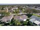 Birds-eye view of a property featuring mature landscaping, a screened lanai, and neighborhood streets at 1508 Lakewood Dr, The Villages, FL 32162