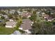 Aerial view of a home featuring a well-maintained roof, screened-in lanai, and a landscaped yard at 1508 Lakewood Dr, The Villages, FL 32162