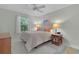 Cozy bedroom with comfortable bed, soft lighting, and relaxing decor at 1508 Lakewood Dr, The Villages, FL 32162