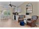 Cozy dining area with a chandelier, complemented by wicker chairs for a blend of comfort and charm at 1508 Lakewood Dr, The Villages, FL 32162