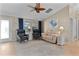 Bright and airy living room with comfortable seating, a neutral color palette, and ample natural light at 1508 Lakewood Dr, The Villages, FL 32162