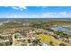 Picturesque aerial view showcasing the harmonious blend of residential homes with the beauty of nature in the background at 15307 Petrus Ln, Clermont, FL 34714