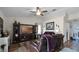 Comfortable living room showcasing stylish furnishings, a ceiling fan, and wood-look flooring at 15307 Petrus Ln, Clermont, FL 34714