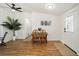 A dining area with a table set for two, wooden chairs and tropical decorations at 1623 W Schwartz Blvd, The Villages, FL 32159