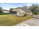 View of house, shed, and fenced yard, perfect for outdoor activities and relaxation at 16456 Meredrew Ln, Clermont, FL 34711