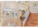 Grand foyer showcasing soaring ceilings, tile flooring, a staircase, and an open view of the home's layout at 16456 Meredrew Ln, Clermont, FL 34711