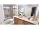 Bathroom featuring a shower and vanity with decor and decorative towels at 1670 Kensington Pl, The Villages, FL 32162