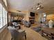 Bright and airy living room with tile floors, fireplace, and an open layout at 1670 Kensington Pl, The Villages, FL 32162