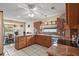 Well-lit kitchen with granite counters, tile floors, and stainless steel appliances at 1732 Madero Dr, Lady Lake, FL 32159