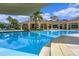 Resort-style pool with a covered lounge area and ample seating for relaxation at 17369 Blazing Star Cir, Clermont, FL 34714