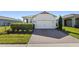 Charming single-Gathering home with a two-car garage and landscaped front yard at 17369 Blazing Star Cir, Clermont, FL 34714