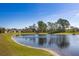 Beautiful tranquil lake view near backyards of beautiful homes at 17369 Blazing Star Cir, Clermont, FL 34714