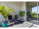 Back patio with sliding glass doors, patterned outdoor rug and comfortable seating at 17369 Blazing Star Cir, Clermont, FL 34714