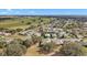 Aerial view of neighborhood featuring winding roads and lush landscaping at 21051 Royal St Georges Ln, Leesburg, FL 34748