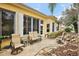 Back patio featuring seating area and peaceful waterfall at 21051 Royal St Georges Ln, Leesburg, FL 34748