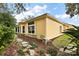 Exterior of home with rock landscaping and large windows with white trim at 21051 Royal St Georges Ln, Leesburg, FL 34748