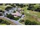 Aerial view of the community golf course and clubhouse, showcasing beautifully landscaped grounds at 21051 Royal St Georges Ln, Leesburg, FL 34748