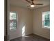 Cozy bedroom featuring two windows offering lots of natural light and wood flooring at 2210 Grant Ave, Eustis, FL 32726