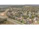 An aerial view of a neighborhood with mature trees, showcasing single-Gathering homes in a peaceful, residential setting at 2214 Lake Pointe Cir, Leesburg, FL 34748