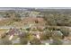 Overhead photo focusing on home lot lines and surrounding landscape with lake views at 2214 Lake Pointe Cir, Leesburg, FL 34748