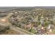 An aerial view showcases property lines in a tree-filled residential area near a lake, highlighting neighborhood charm at 2214 Lake Pointe Cir, Leesburg, FL 34748