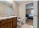 Bathroom featuring a wood vanity and an open door leading to the bedroom at 2214 Lake Pointe Cir, Leesburg, FL 34748