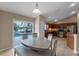 Cozy dining room attached to kitchen with an island and stainless appliances at 2214 Lake Pointe Cir, Leesburg, FL 34748