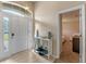 Bright entryway featuring tile flooring and a decorative table with stylish accents at 2214 Lake Pointe Cir, Leesburg, FL 34748