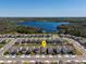 Home aerial view displays the property's placement in a community near the lake and trees at 2365 Palm Park Loop, Clermont, FL 34714