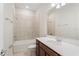 Bathroom featuring a single sink vanity, bath tub, and tiled shower at 2365 Palm Park Loop, Clermont, FL 34714