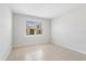 Neutral bedroom featuring tile floors and a window with blinds at 2365 Palm Park Loop, Clermont, FL 34714