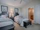 Bedroom featuring two beds and a peek into the ensuite bathroom at 2506 Greenhill Trl, The Villages, FL 32162