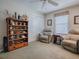 Comfortable bedroom with two recliner chairs, a closet, and a display shelf at 2506 Greenhill Trl, The Villages, FL 32162