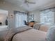 Inviting bedroom featuring two beds, with a work space, soft carpet, and natural light at 2506 Greenhill Trl, The Villages, FL 32162