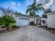 Charming single-story home features a two-car garage, well-manicured landscaping, and a concrete driveway at 2506 Greenhill Trl, The Villages, FL 32162