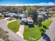 Charming single-story home with well-maintained lawn and mature trees in a quiet neighborhood setting at 25546 Belle Alliance, Leesburg, FL 34748