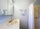 Bright bathroom with vanity, mirror, towel bar, and shower at 25546 Belle Alliance, Leesburg, FL 34748