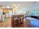 Well-lit kitchen with breakfast bar, connecting the cooking space to the living area for easy entertaining at 25546 Belle Alliance, Leesburg, FL 34748