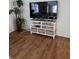 Living room features a white shelving unit, decorative baskets, and modern decor at 263 Pinewood Dr, Eustis, FL 32726