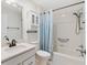 Clean bathroom with a shower over tub, modern fixtures, and ample cabinet space at 3176 Atwell Ave, The Villages, FL 32162