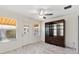 Bright dining room with marble flooring and a built-in display cabinet at 3176 Atwell Ave, The Villages, FL 32162