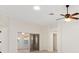 Living room area showing sliding glass door and ceiling fan at 3176 Atwell Ave, The Villages, FL 32162