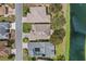 Overhead view of houses showing roof types and the surrounding community at 321 Ranchwood Dr, Leesburg, FL 34748