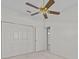 Bright bedroom features a ceiling fan and closet space at 321 Ranchwood Dr, Leesburg, FL 34748